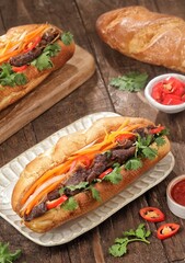 Banh mi is a flatbread or sandwich containing vegetables and sliced ​​meat.