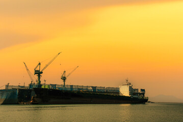 Industry landscape on sunset Engineering shipping crane depot at logistic export terminal control....