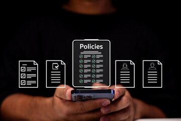 A person holds a smartphone displaying digital policy documents with icons of multiple files...