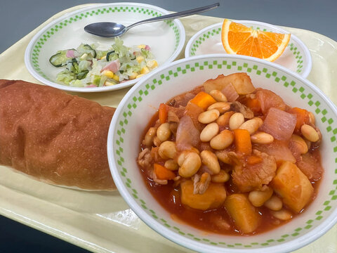 Pork and beans school lunch paired with koppe pan bread in Japan.