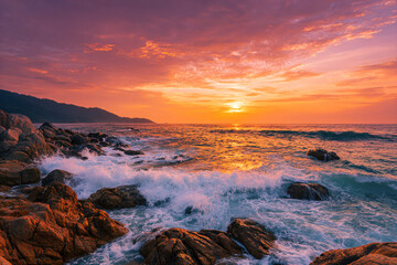 Fototapeta premium a sunset over the ocean with rocks and waves