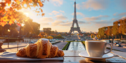 Hot coffee and delicious French croissants with beautiful view to Paris, France.