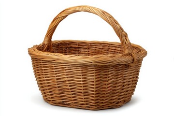 A rustic woven wicker basket with a sturdy handle sits isolated on a clean white background
