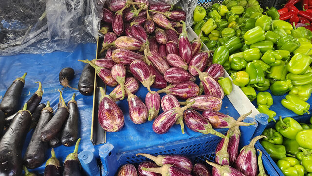 Fruits and vegetables in baskets and crates in the grocery section