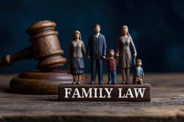 A representation of family law, featuring a family figurine set alongside a gavel.