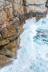 The Southern Ocean breaking on the entrance to The Gap in the Torndirrup National Park near Albany in the Shire of Denmark, Great Southern region of Western Australia, WA, Australia.