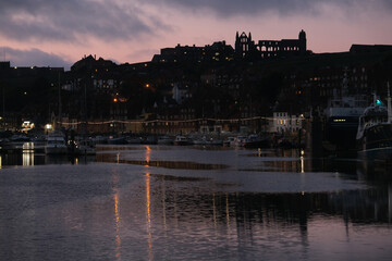 Whitby is a seaside town in Yorkshire, northern England, split by the River Esk. On the East Cliff, overlooking the North Sea, the ruined Gothic Whitby Abbey was Bram Stoker’s inspiration for “Dracula