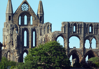 Whitby is a seaside town in Yorkshire, northern England, split by the River Esk. On the East Cliff, overlooking the North Sea, the ruined Gothic Whitby Abbey was Bram Stoker’s inspiration for “Dracula