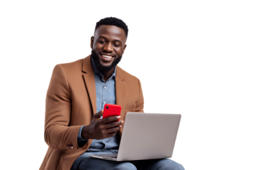 Smiling man working on laptop and phone