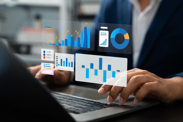 Professional businessman using laptop to review performance indicators, Business growth charts, Market research data for financial and investment decisions. Strategic planning and corporate success.
