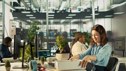 Happy employee starting first day at new job, unpacking belongings, meeting coworkers. Cheerful worker arriving in office, starting work on new company position, being welcomed by team, camera B