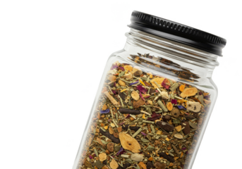 Isolated Herbal Tea Blend in Transparent Glass Bottle on Black Background