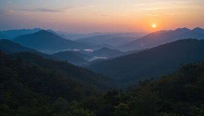 Breathtaking mountain landscapes unveil a serene sunset or sunrise sky, often cloaked in mist or clouds, revealing the beauty of nature's panorama