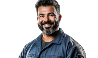 Smiling Male Worker in Uniform with Beard, Professional Appearance, Isolated on Black Background, Portrait for Diverse Corporate and Industry Use