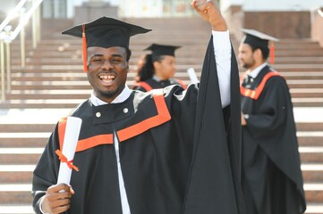 Happy graduate. Happy African man in graduation gowns