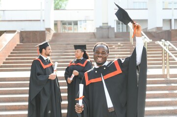 Happy graduate. Happy African man in graduation gowns