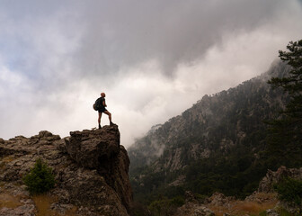 man on top of mountain