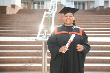 Excited African American woman at her graduation