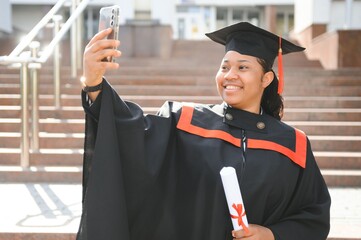 pretty african female college graduate at graduation