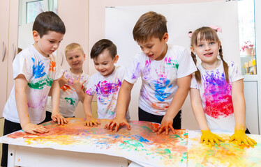 Creative Young Artists Express Their Imagination Through Vibrant Hands-On Painting Activity in a...