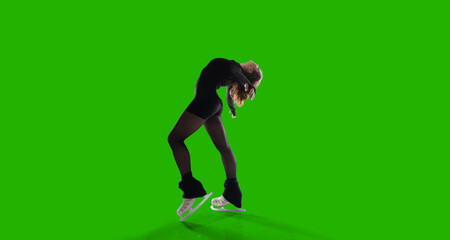 Figure skater woman on green screen.