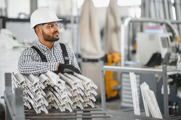 PVC industry worker or operator making frames for windows and doors
