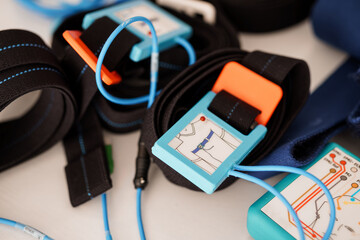 Polysomnography Setup with Blue Straps: Electrodes and Sensors for Sleep Study Monitoring, Focus on...
