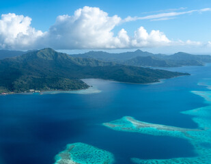 Aerial view of Tahaa island, French Polynesia, with turquoise lagoon and reef © daboost