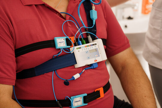Patient Monitoring with Holter Scanner: Red Shirt Chest Pack, ECG Electrodes, Digital Recorder, Healthcare Technology, Medical Device, Clinical Setting
