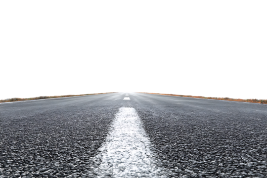 Empty asphalt road vanishing into darkness.