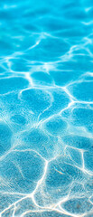 Clear blue water with light reflections creating a rippling pattern on the surface.