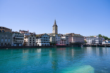 Scenic view of skyline of the medieval old town of Swiss city of Zürich with church tower and...