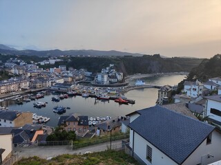 Sunset illuminating picturesque coastal town of viavélez, asturias, spain