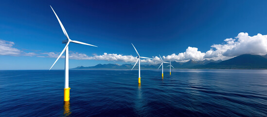 Offshore wind turbines with yellow bases stand in calm blue ocean water under bright sky with clouds and distant mountains, symbolizing clean energy and environmental innovation
