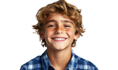 Happy young boy with curly hair and freckles wearing a plaid shirt, smiling against a black background, capturing joy and innocence in childhood moments