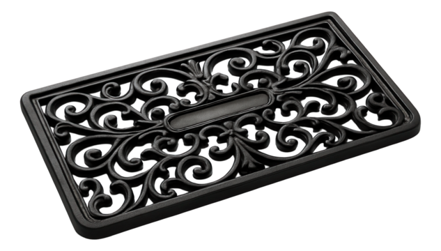 Cast iron outdoor threshold for a historical home, with intricate scrollwork design.
