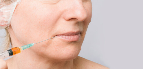 A woman at a skin care appointment with a cosmetologist with injections to rejuvenate and nourish...