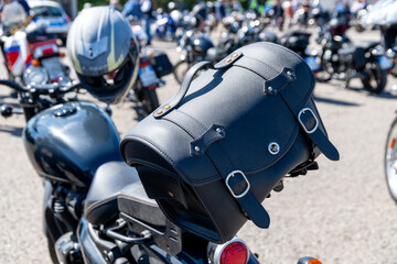Motorcycle with leather saddlebag at public event