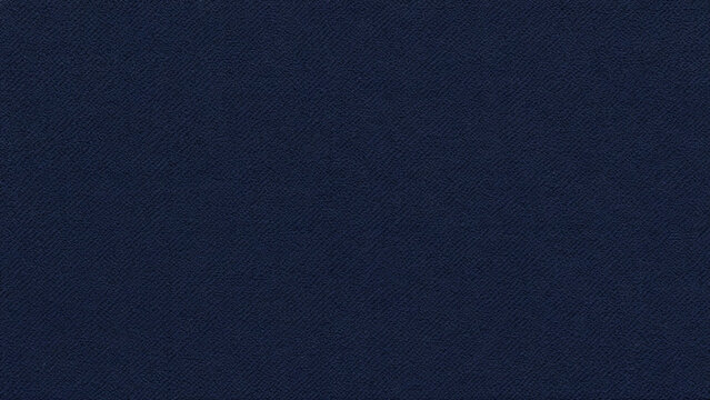 A detailed close up macro shot showcasing the textured surface of a dark navy blue fabric with a subtle woven pattern and a matte finish