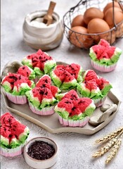 Bolu Kukus Semangka. Watermelon steamed bolu is a traditional Indonesian snack in the form of steamed sponge cake colored like watermelon