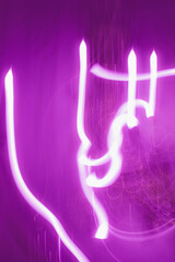 Creative expression through vibrant light trails in a dark space