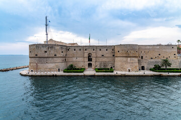 Symmetrical coastal fortress with Italian flag and sea