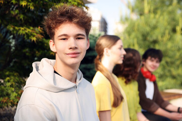 Teenagers spending time together in park, selective focus