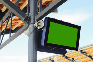 Train station digital display. Blank green screen for timetable. Empty board at modern railway...