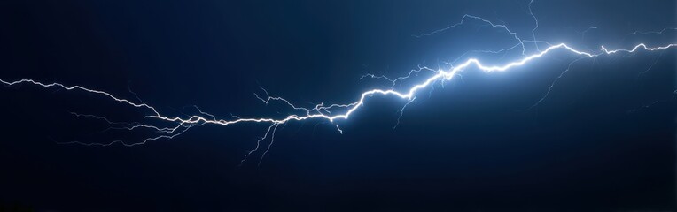 High-Voltage Lightning Strike Illuminating Stormy Night Sky with Dramatic Energy and Power Display, Ideal for Atmospheric and Nature Photography Concepts