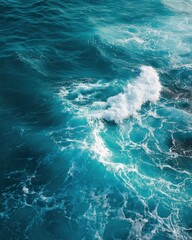Pure blue turquoise water texture of the ocean sea with foam from and waves. MZ 