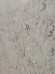 Foam squash pattern creating abstract design on car during washing process