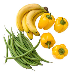 Fresh, ripe yellow banana with organic green beans and yellow peppers, all isolated for a healthy vegetable and fruit display