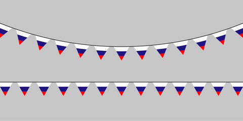 Obraz premium Patriotic bunting flags in red, blue, and white hanging on strings against a neutral gray background — festive, minimal, and versatile.