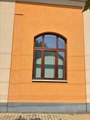 Window on an orange building.